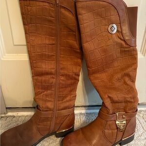 Tall suede like boots with decorative details and side zip. Top has expansion. 7